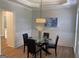 Dining area featuring wood floors, decorative trim and modern lighting at 219 Maple Creek Chase, Woodstock, GA 30188