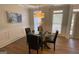 Cozy dining area featuring hardwood flooring, modern lighting, and neutral wall tones at 219 Maple Creek Chase, Woodstock, GA 30188