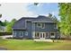 Expansive backyard exterior showcases a well-manicured lawn and mature landscaping at 219 Maple Creek Chase, Woodstock, GA 30188