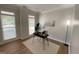Bright home office featuring ample natural light and hardwood floors creating an inviting atmosphere at 219 Maple Creek Chase, Woodstock, GA 30188