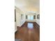 Spacious dining room featuring hardwood floors, wainscoting, and a chandelier fixture at 3008 Brighton Ct, Conyers, GA 30094