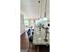 Kitchen island with granite countertop and bar stool seating, open to the living area at 3008 Brighton Ct, Conyers, GA 30094