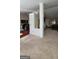 Open-concept living space with modern finishes, connecting kitchen, living and entry areas at 3008 Brighton Ct, Conyers, GA 30094