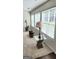Bright living room with large windows and stylish lamps on glass tables at 3008 Brighton Ct, Conyers, GA 30094