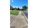 Street view showcasing well-maintained lawns, trees, and sidewalks in a residential neighborhood at 3008 Brighton Ct, Conyers, GA 30094