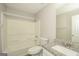 Well-lit bathroom featuring a tub/shower combo and a vanity with a granite countertop at 3587 Oakvale Ave, Decatur, GA 30034