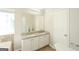 Well-lit bathroom with double vanity, granite countertops, and a large mirror, providing a luxurious feel at 3587 Oakvale Ave, Decatur, GA 30034