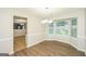 Bright dining room featuring elegant chandelier, large windows, and modern flooring, perfect for Gathering meals at 3587 Oakvale Ave, Decatur, GA 30034