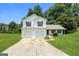 Charming two-story home with a two-car garage and well-maintained front yard, perfect for suburban living at 3587 Oakvale Ave, Decatur, GA 30034