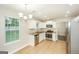 Well-lit kitchen with stainless steel appliances, tile flooring, and ample counter space for culinary enthusiasts at 3587 Oakvale Ave, Decatur, GA 30034