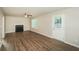 Spacious living room featuring wood floors, a fireplace, and a ceiling fan, great for relaxing or entertaining guests at 3587 Oakvale Ave, Decatur, GA 30034