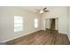 Inviting living room with beautiful flooring, ceiling fan, and large windows, perfect for relaxation and entertaining at 3587 Oakvale Ave, Decatur, GA 30034