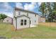 Exterior shot of the backyard featuring a grass lawn and privacy fence at 107 Cedar Brook Dr, Canton, GA 30115