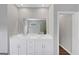 Bathroom vanity with double sinks and elegant white cabinets at 107 Cedar Brook Dr, Canton, GA 30115