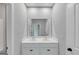 Bathroom showcasing a double sink vanity, with neutral walls and cabinets, and a large mirror at 107 Cedar Brook Dr, Canton, GA 30115