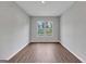 Bright bedroom with hardwood floors and window, offering a comfortable living space at 107 Cedar Brook Dr, Canton, GA 30115