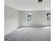 Spacious carpeted bedroom featuring two bright windows at 107 Cedar Brook Dr, Canton, GA 30115