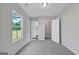 Carpeted bedroom with window, closet, and ensuite access, perfect for relaxation at 107 Cedar Brook Dr, Canton, GA 30115