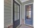 A close-up of the home's entrance, showcasing stylish doors, complementing the home's architectural features at 107 Cedar Brook Dr, Canton, GA 30115