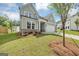 Charming two-story home with a well-manicured lawn and light blue siding, complemented by an attached two-car garage at 107 Cedar Brook Dr, Canton, GA 30115