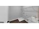 The laundry room features wooden floors, neutral colored walls, and a sink with storage underneath at 107 Cedar Brook Dr, Canton, GA 30115