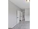 A room featuring neutral walls and light gray carpet, with doorways that lead to other rooms in the house at 107 Cedar Brook Dr, Canton, GA 30115