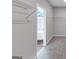 View from a bedroom into an organized walk-in closet with shelves at 107 Cedar Brook Dr, Canton, GA 30115