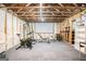 Basement featuring finished carpet and walls, exposed ceiling, and workout equipment at 2750 Brentwood Estates Ct, Cumming, GA 30041