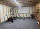 Spacious basement gym area with equipment and a projector screen at 2750 Brentwood Estates Ct, Cumming, GA 30041