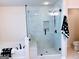 Modern bathroom featuring a glass shower with white subway tile and a soaking tub at 2750 Brentwood Estates Ct, Cumming, GA 30041
