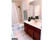 Bathroom with vanity, a tiled shower behind a curtain, and a large mirror at 2750 Brentwood Estates Ct, Cumming, GA 30041