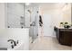 Bathroom with a glass-enclosed shower, soaker tub, and modern fixtures at 2750 Brentwood Estates Ct, Cumming, GA 30041