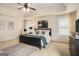 Bedroom with a ceiling fan, natural light, bed and dark dresser at 2750 Brentwood Estates Ct, Cumming, GA 30041