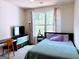 Cozy bedroom featuring neutral tones, ample natural light, desk area and comfortable furnishings at 2750 Brentwood Estates Ct, Cumming, GA 30041