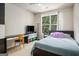 Comfortable bedroom featuring a desk, a window with view and cozy décor at 2750 Brentwood Estates Ct, Cumming, GA 30041