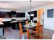 Stylish dining area adjacent to the kitchen featuring a modern table and chairs at 2750 Brentwood Estates Ct, Cumming, GA 30041