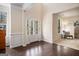 Inviting foyer with high ceilings, detailed trim work, and natural light from large windows at 2750 Brentwood Estates Ct, Cumming, GA 30041