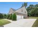Attached two-car garage and driveway, with brick and siding exterior at 2750 Brentwood Estates Ct, Cumming, GA 30041
