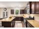 Modern kitchen features granite countertops, stainless steel appliances, and ample cabinet space at 2750 Brentwood Estates Ct, Cumming, GA 30041