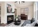 Cozy living area with a fireplace, piano, and comfortable seating for relaxing and entertaining at 2750 Brentwood Estates Ct, Cumming, GA 30041