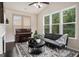 Comfortable living space featuring large windows, a piano, and stylish furnishings at 2750 Brentwood Estates Ct, Cumming, GA 30041