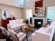Airy living room with modern decor, fireplace, large windows, and comfortable seating at 2750 Brentwood Estates Ct, Cumming, GA 30041