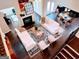 Open concept living space with contemporary furnishings, fireplace, and clear view to other areas at 2750 Brentwood Estates Ct, Cumming, GA 30041