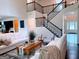 Inviting living room showcasing a staircase, modern furniture, and tasteful decor at 2750 Brentwood Estates Ct, Cumming, GA 30041