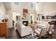 Spacious living room boasts tall ceilings, a cozy fireplace, and an open flow to the kitchen at 2750 Brentwood Estates Ct, Cumming, GA 30041