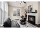 Relaxing living area with fireplace, comfortable seating, and scenic outdoor views at 2750 Brentwood Estates Ct, Cumming, GA 30041