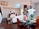 Bright, naturally lit living and dining areas with wood floors, fireplace, and stylish decor at 2750 Brentwood Estates Ct, Cumming, GA 30041