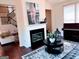 Comfortable living room with a fireplace, decorative rug, and adjacent piano at 2750 Brentwood Estates Ct, Cumming, GA 30041