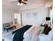 Comfortable main bedroom with two windows, and seating area at 2750 Brentwood Estates Ct, Cumming, GA 30041