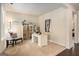 Bright office space with a large window, desk, shelves, and cozy chair at 2750 Brentwood Estates Ct, Cumming, GA 30041